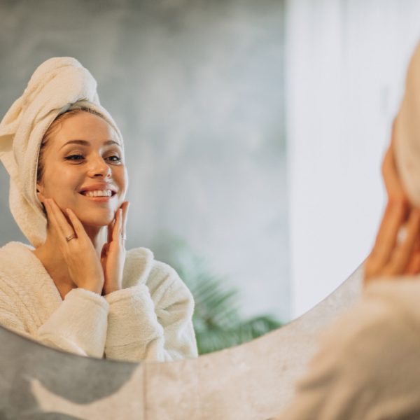woman-home-applying-cream-mask